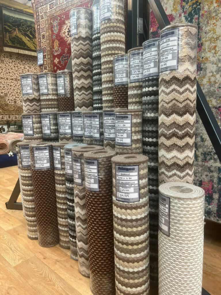 Wide view image of custom made carpet rugs organised and tidy.