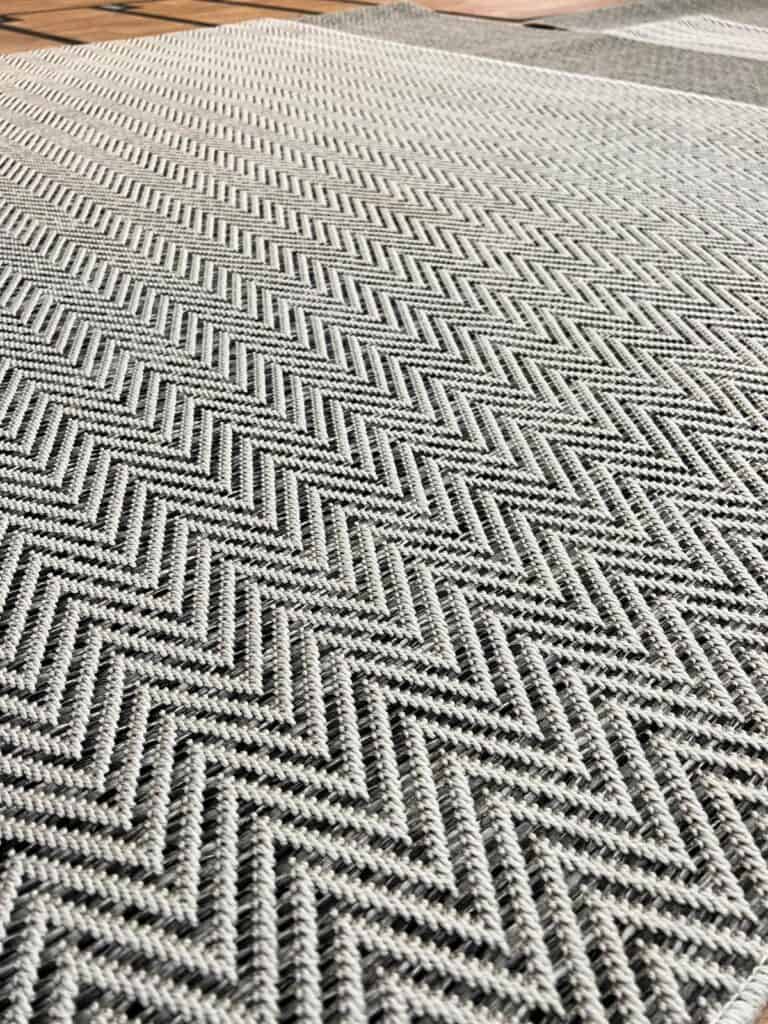 Close up image of the herringbone pattern on the herringbone custom made carpet rug.