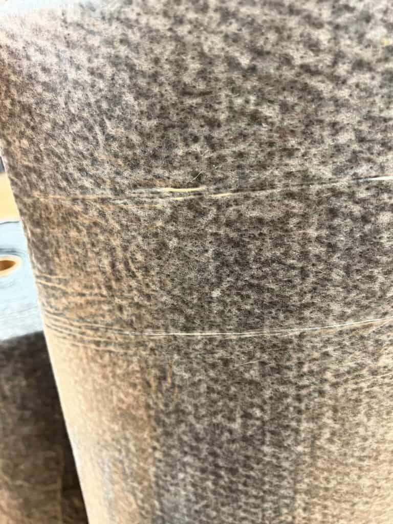 Grey side of rug antiskid