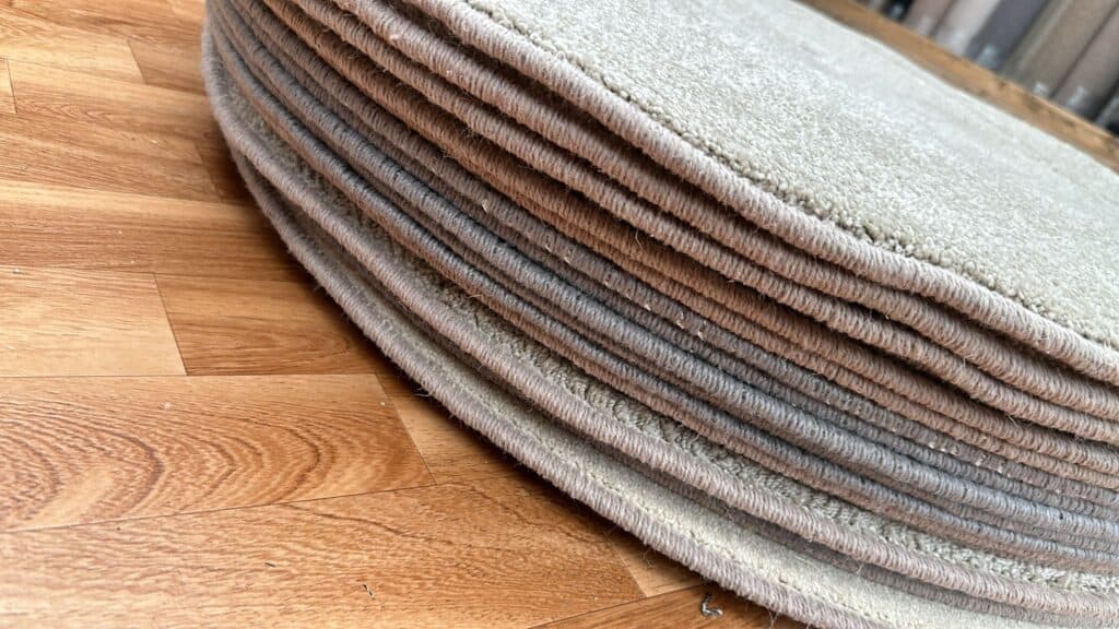 Close up image of circle rugs in a pile