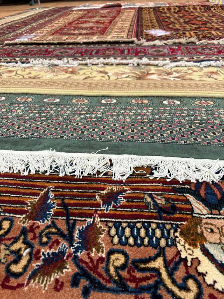 Close up image showing traditional oriental rugs laid out 