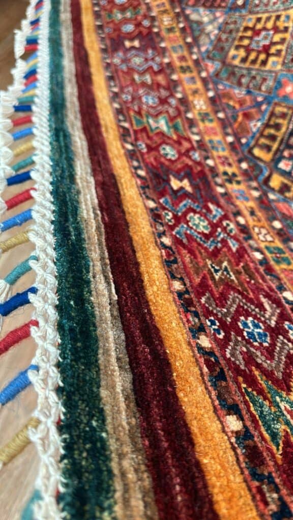 Close up image of the fringe on the modern oriental rug