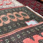 Image showing oriental rugs all laid out on the floor.