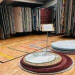 Fringes of Plymouth top showroom with rugs on display
