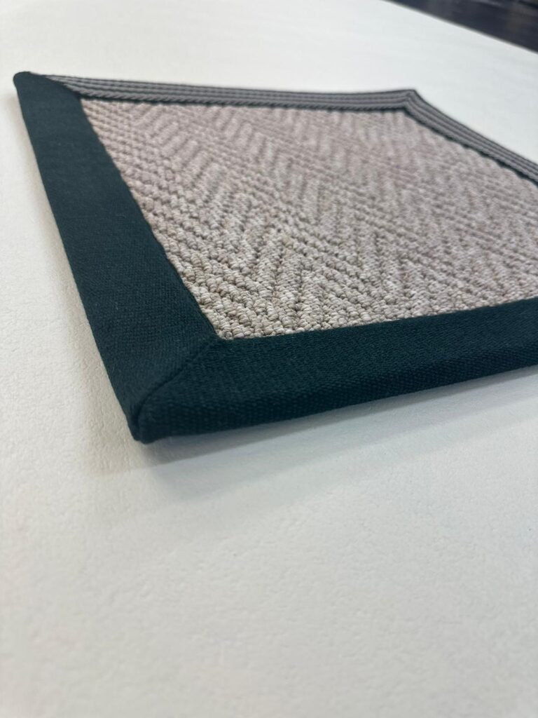Textured canvas with green border on white surface
