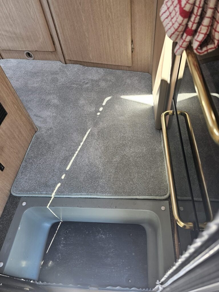 Motorhome entry way with new carpet  with bound edges